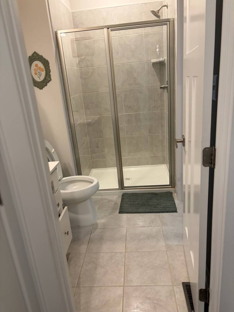 Glass shower door and tile deep cleaned by Inca Shine Cleaning