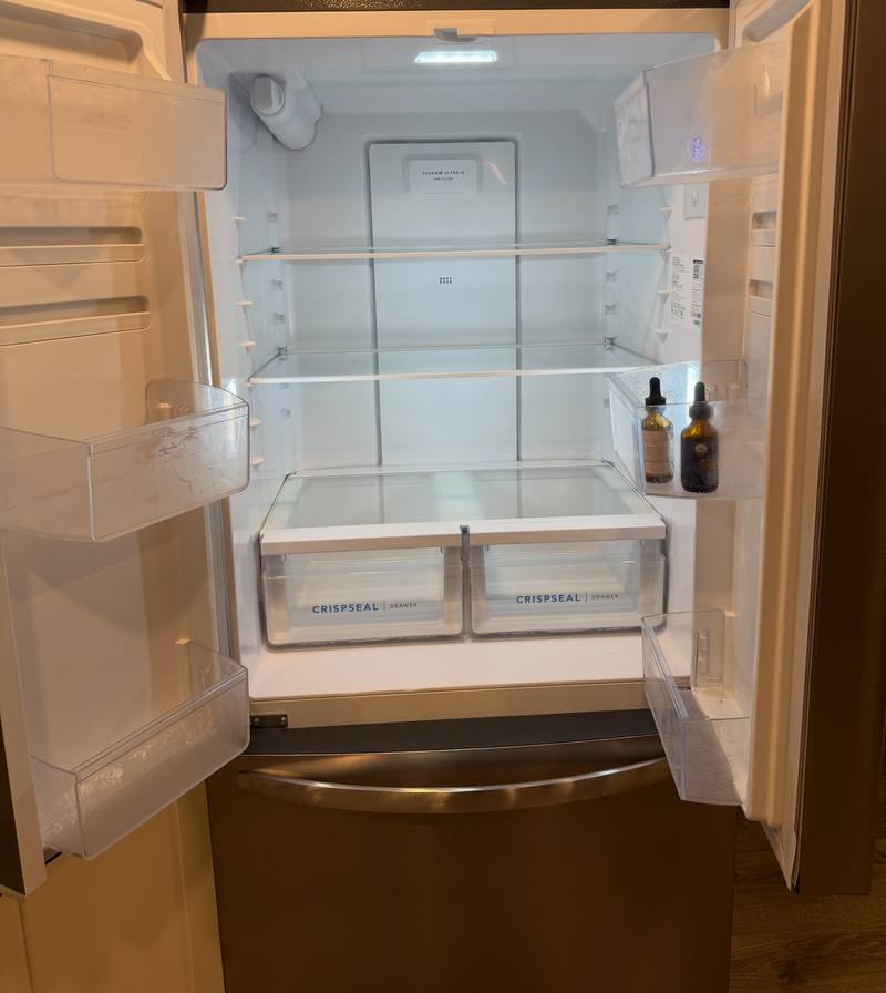 Inspection-ready refrigerator cleaned inside during a move out cleaning