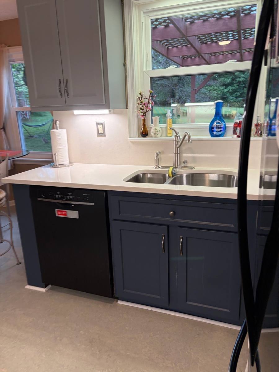 Spotless kitchen sink and countertop after a cleaning service